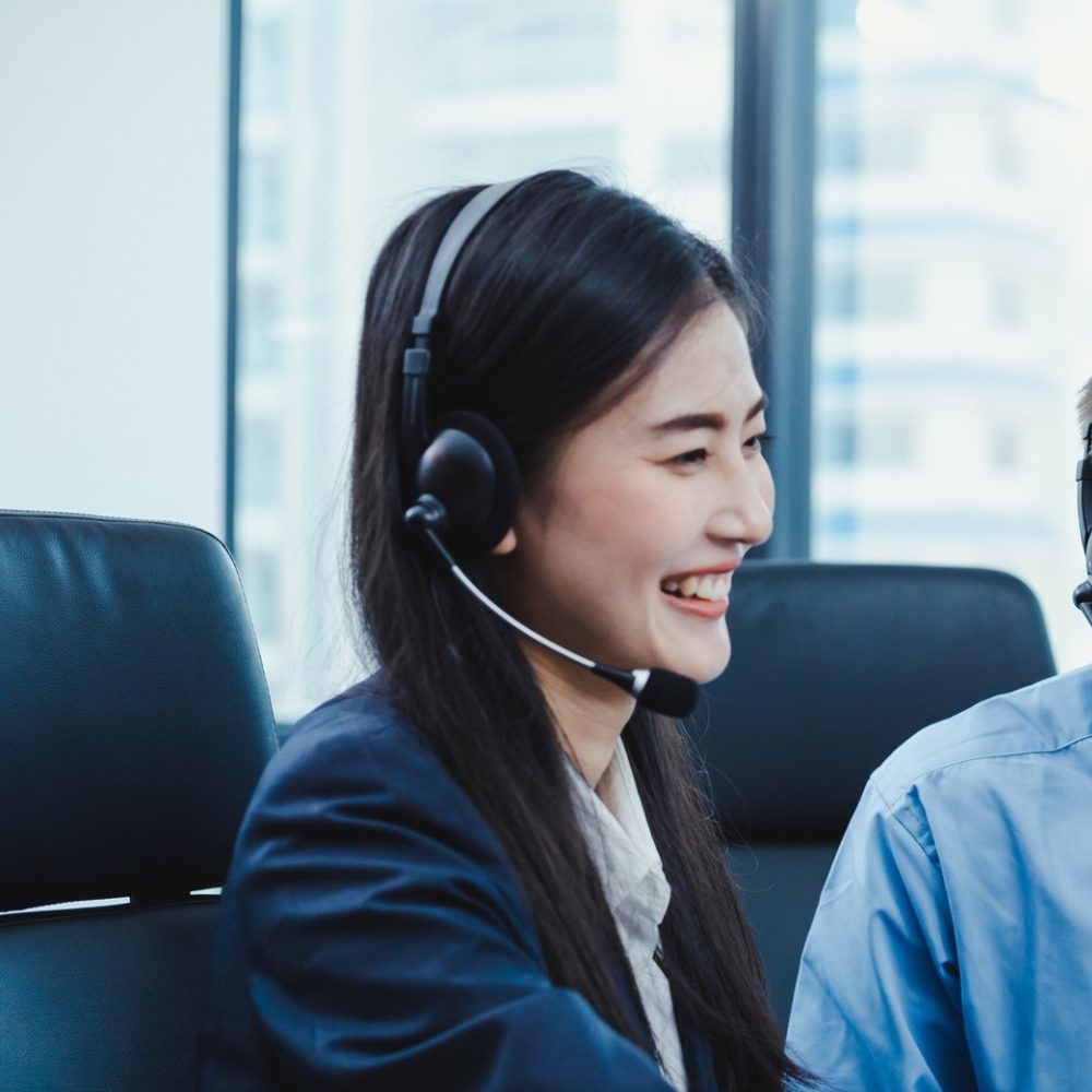 Group of diverse telemarketing customer service staff team in call center.